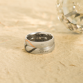 Half Heart Two Tone "Real Love" Ring for female and male on sand with crystal at the background