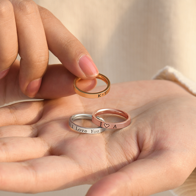 rose, silver, and rose gold Custom Engraved Ring on model's palm