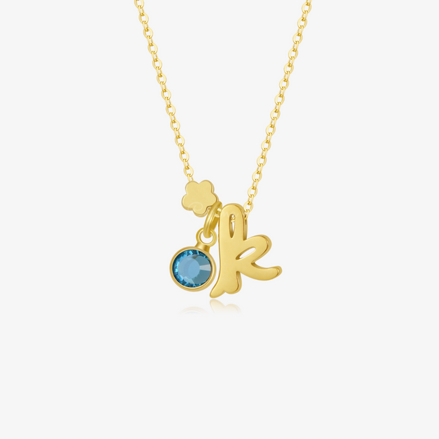 Personalized Birthstone and Initial Necklace with flower shape and a birthstone on white background