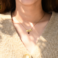 model wearing Personalized Birthstone and Initial Necklace with star shape, initial letter m and a birthstone
