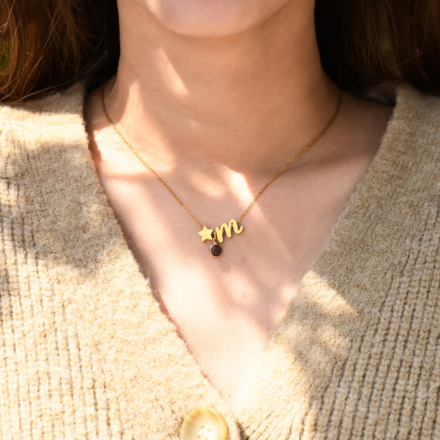 model wearing Personalized Birthstone and Initial Necklace with star shape, initial letter m and a birthstone