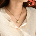 model wearing the gold variant coordinate engraved compass necklace