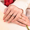 model wearing all three color variants of Dainty Interlocking Fidget Ring - gold, silver, and rose gold