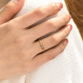 model wearing gold Minimalist Dainty Birthstone Ring with three birthstones
