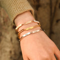 model wearing rose gold, gold, silver Multiple Name Link Bracelets