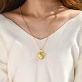 model in white knitted long sleeve wearing the Photo Locket Necklace