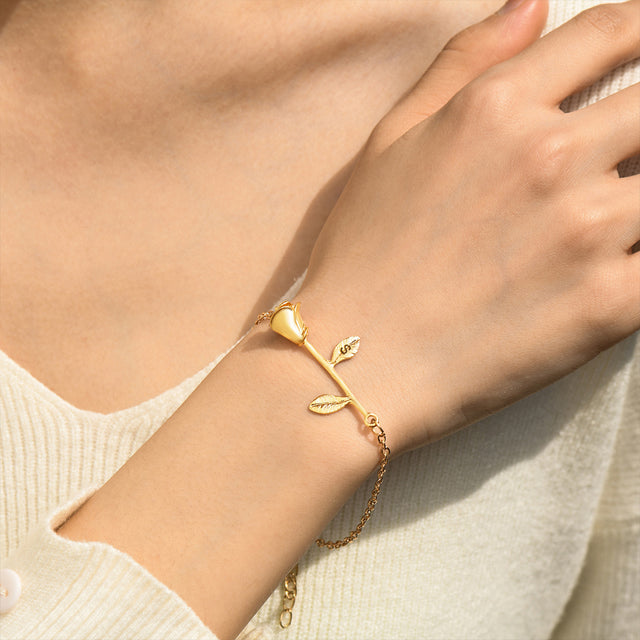 model wearing the gold Beauty and the Beast Rose Initial Bracelet