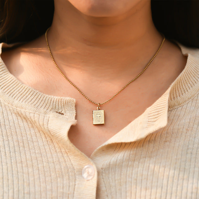 model wearing the Cross Locket Necklace