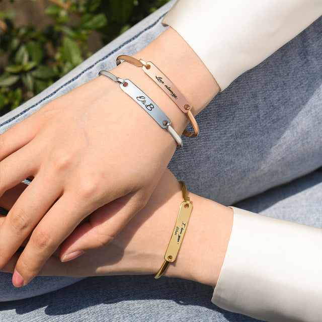 model wearing the gold, rose gold, and silver Custom Handwriting Bar Bracelet