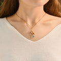 model wearing the Dangling Birthstone Initial Necklace
