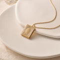 Personalized Book Locket Necklace on white discs