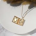 an opened Personalized Book Locket Necklace on white disc