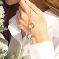 model holding gold and silver Round Ball Locket Necklaces