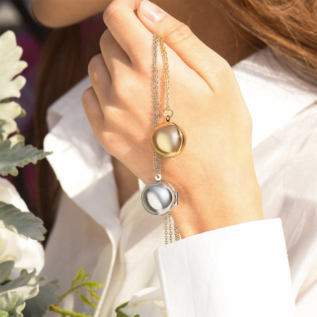 model holding gold and silver Round Ball Locket Necklaces