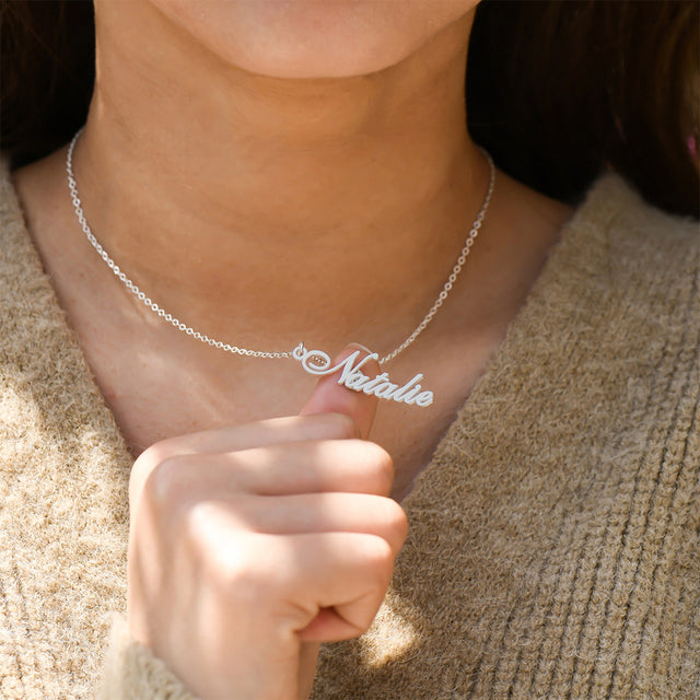 model wearing the silver vertical name necklace