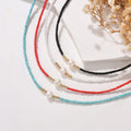 To My Granddaughter, I Am So Proud Of You Freshwater Pearl Necklace in a creative shot
