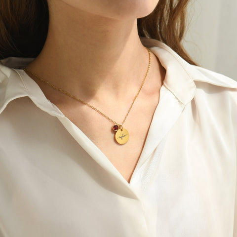 model wearing the gold Monogram Script Birthstone Necklace