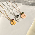 creative image of gold, silver, and rose gold Monogram Script Birthstone Necklaces on a white canvas
