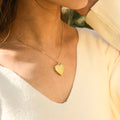 model wearing gold Minimalist Heart Locket Necklace