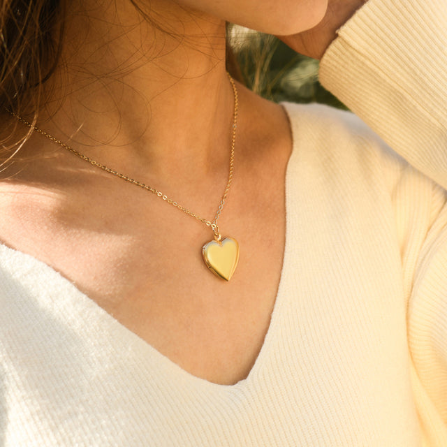 model wearing gold Minimalist Heart Locket Necklace
