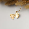 an opened gold Minimalist Heart Locket Necklace on white disc