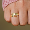 Model wearing gold variant of Personalized Adjustable Plume Ring