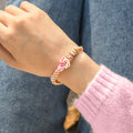 Model wearing a Peach Blossom Knot Bracelet