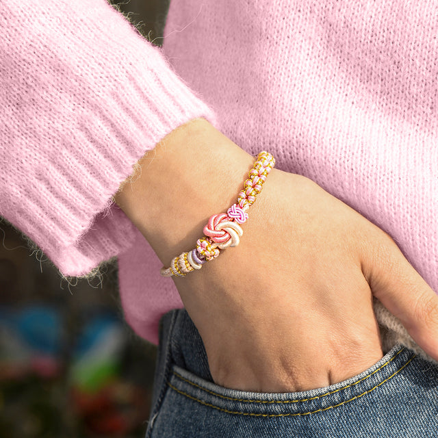 Model wearing a Peach Blossom Knot Bracelet