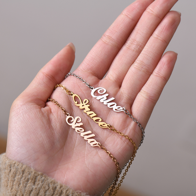 the three color variants of Personalized Script Name Anklet on model's palm