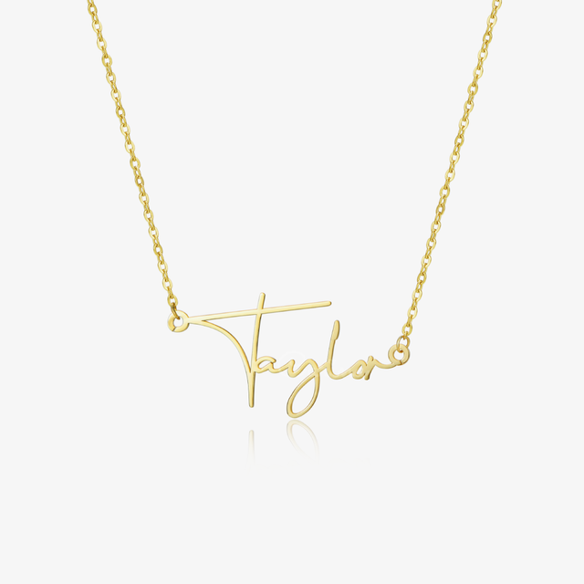 Gold colored Dainty Paris Name Necklace on white background