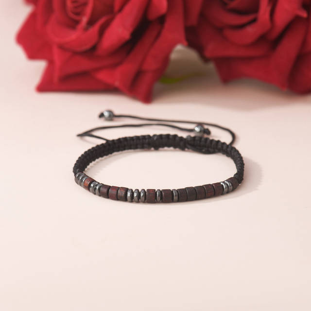 To My Grandson, I Love You Morse Code Bracelet on plain canvas with red roses on the background