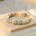 Jasper Name Bracelet on a beige-color square-shape disc