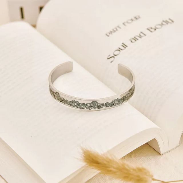 To My Husband In Heaven Memorial Bracelet on an opened book