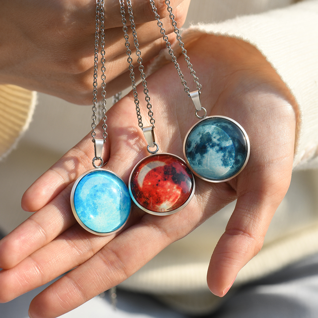 three Custom Moon Phase Necklaces on model's palm