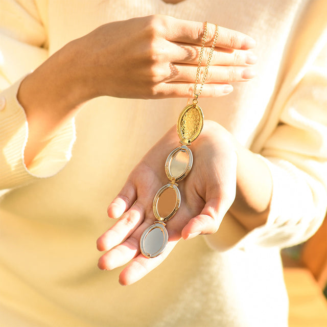 an opened Family Photo Locket Necklace on model's palm