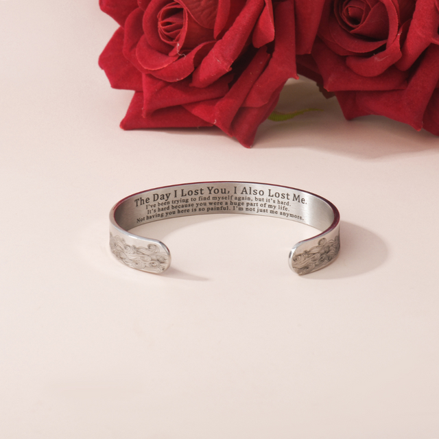 The Day I Lost You Memorial Bracelet on plain canvas with red roses at the background