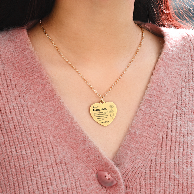 female model wearing the gold engraved heart necklace