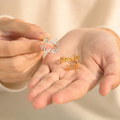 Silver and Gold Custom Double Name Rings on model's hand