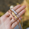 model holding silver, gold ,and rose gold Custom Message Chain Bracelets