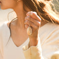 model holding the Family Photo Locket Necklace