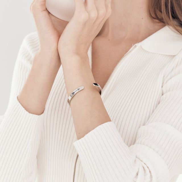 female model wearing silver Not Sisters By Blood, But Sisters By Heart Bracelet