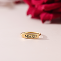 Dainty Bar Ring on a plain canvas with red rose behind it