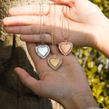 model holding silver, gold, rose gold Dainty Heart Locket Necklaces