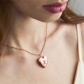 model wearing rose gold Initial Heart Locket Necklace