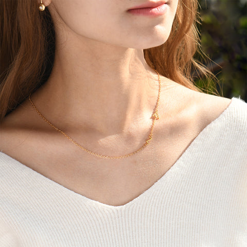 model wearing gold Minimalist Sideway Initial Necklace