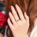 model wearing the gold colored Personalized Baguette Birthstones Ring