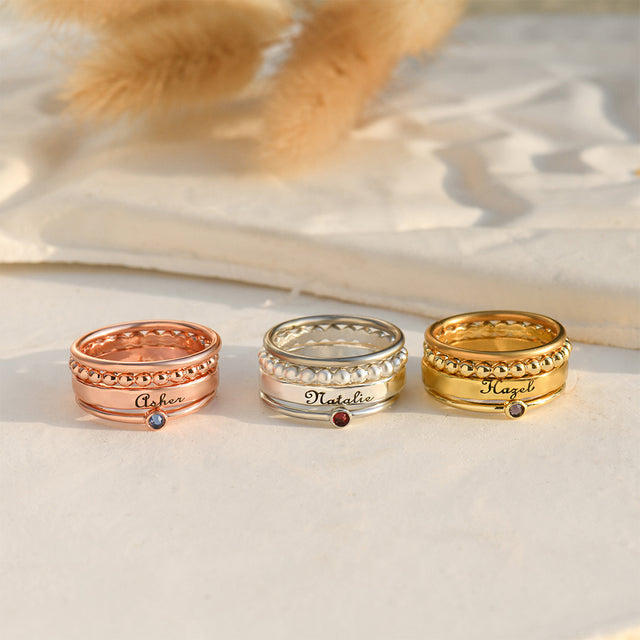 rose gold, silver, and gold Personalized Name Stack Ring on white canvas