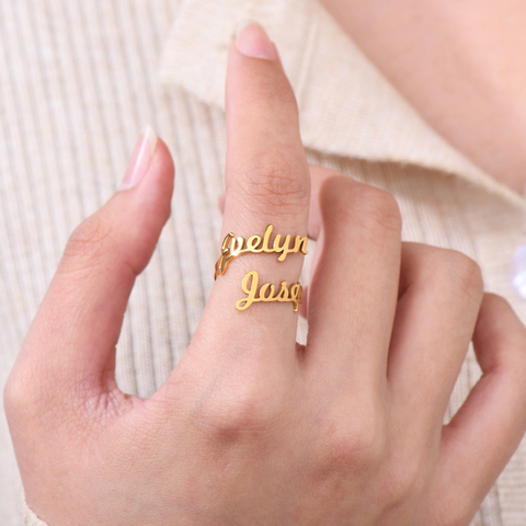 Gold Custom Double Name Ring on female model's finger