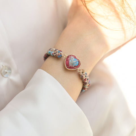 female model wearing red Jasper Heart Bracelet