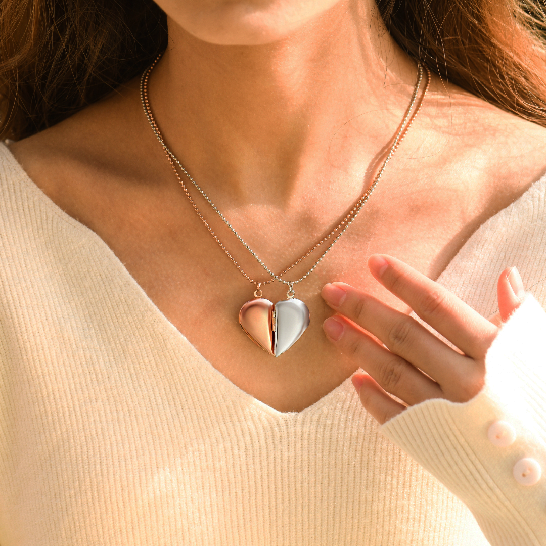 model wearing the silver and rose gold variants Couple's Heart Locket Necklaces